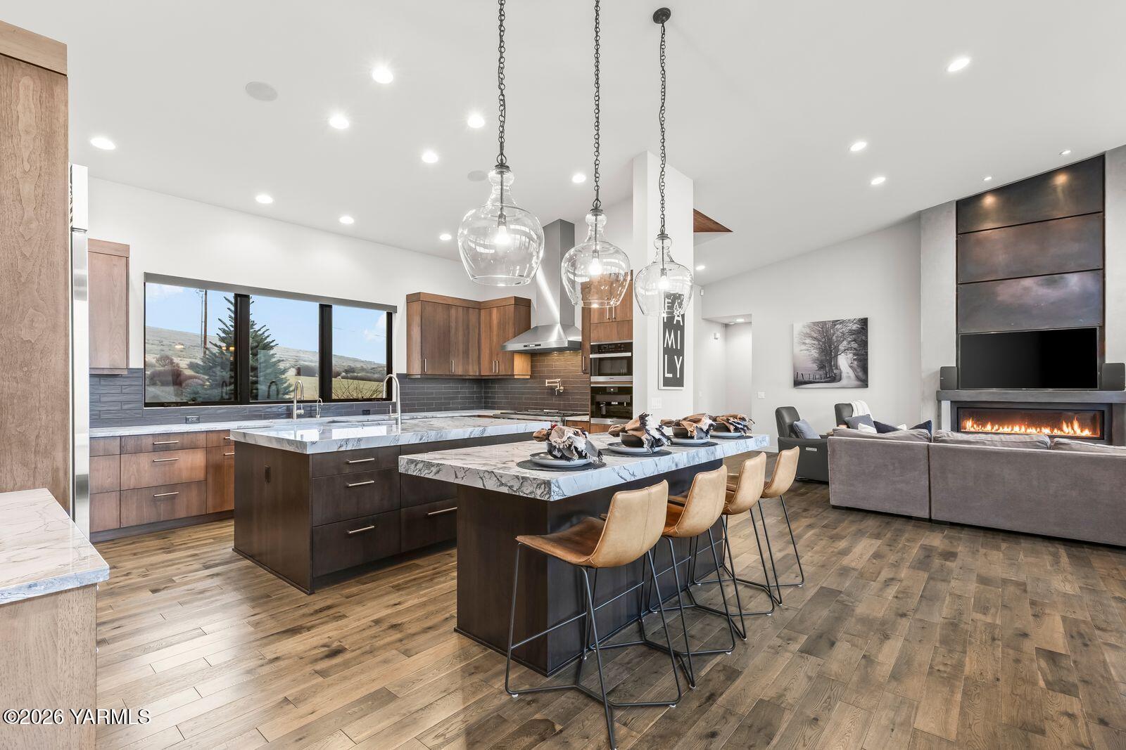 13990 Marble Road Yakima, WA 98908 - Photo 15 of 60 a kitchen with stainless steel appliances granite countertop a stove and a view of living room