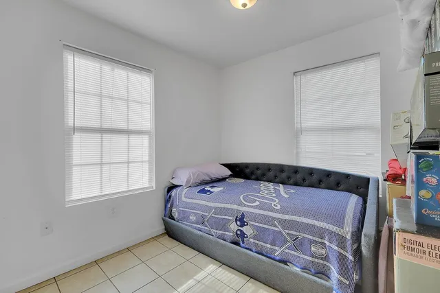 a bedroom with a bed and a dresser