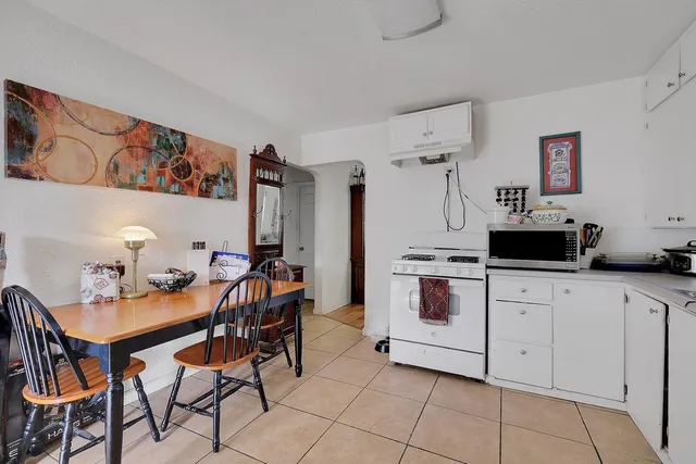 a kitchen with stainless steel appliances a stove a sink and a refrigerator