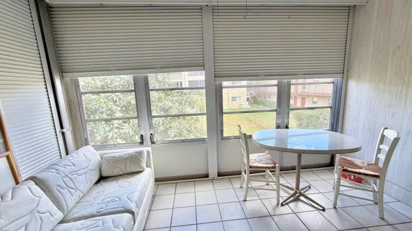 a living room with furniture and a window