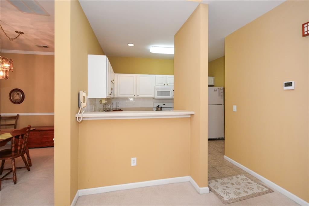 1471 Settlers Walk Way, Unit 5 Marietta, GA 30060 - Photo 12 of 29 a view of kitchen with granite countertop cabinets and sink
