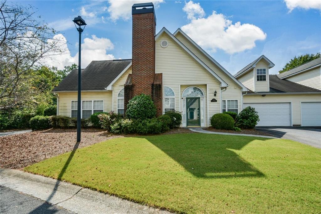 1471 Settlers Walk Way, Unit 5 Marietta, GA 30060 - Photo 2 of 29 a view of a house with backyard and a tree
