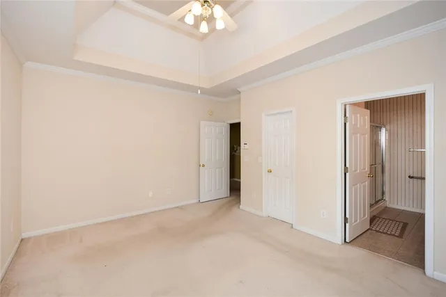 a view of an empty room with a chandelier