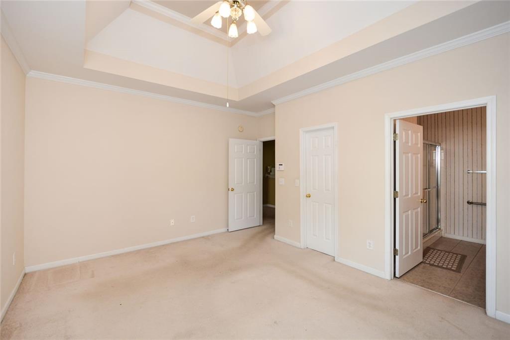 1471 Settlers Walk Way, Unit 5 Marietta, GA 30060 - Photo 22 of 29 a view of an empty room with a chandelier