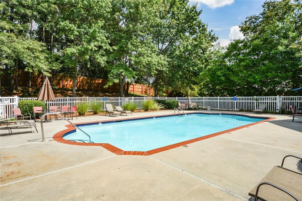 1471 Settlers Walk Way, Unit 5 Marietta, GA 30060 - Photo 26 of 29 a view of a swimming pool with a lounge chair