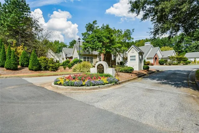 a house with lots of trees in the background