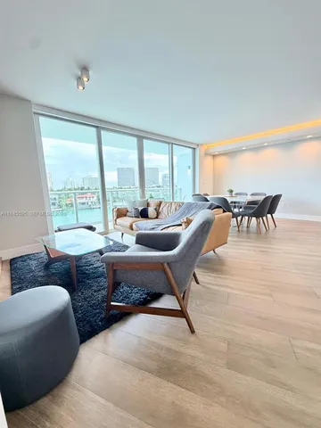 a kitchen with stainless steel appliances kitchen island granite countertop a stove and a sink
