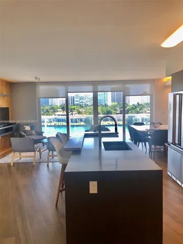 a living room with dining table and chairs