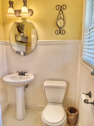 a view of a room with wooden floor and furniture