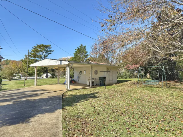 a view of a park with large trees