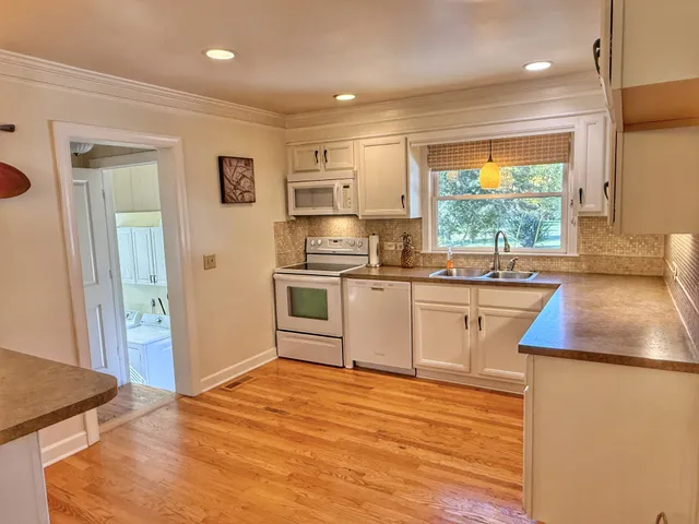 a bathroom with a sink a vanity and a mirror