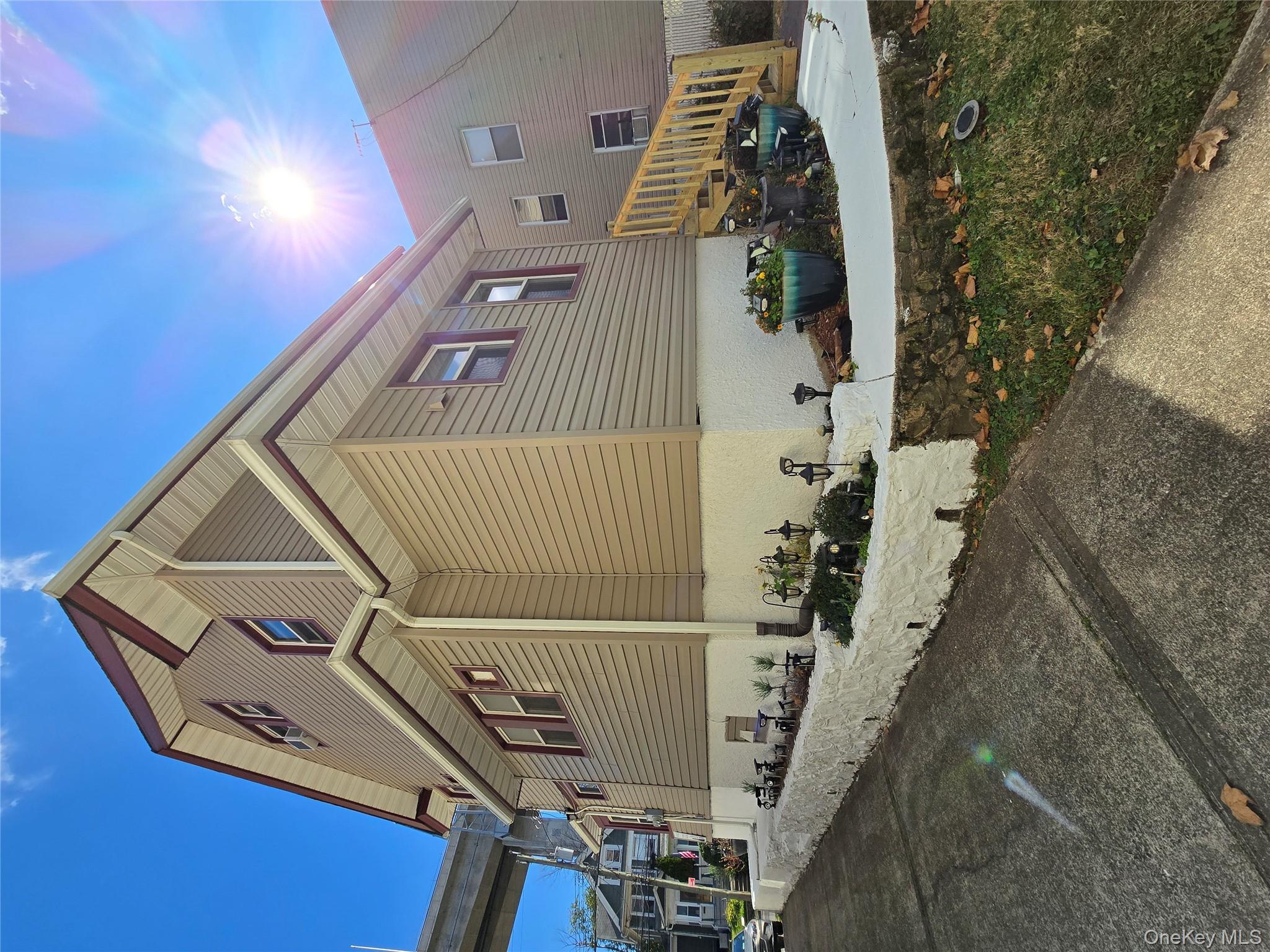 View of side of home with a patio