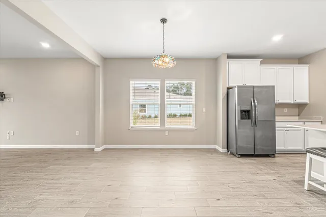 a view of a kitchen with a sink and microwave