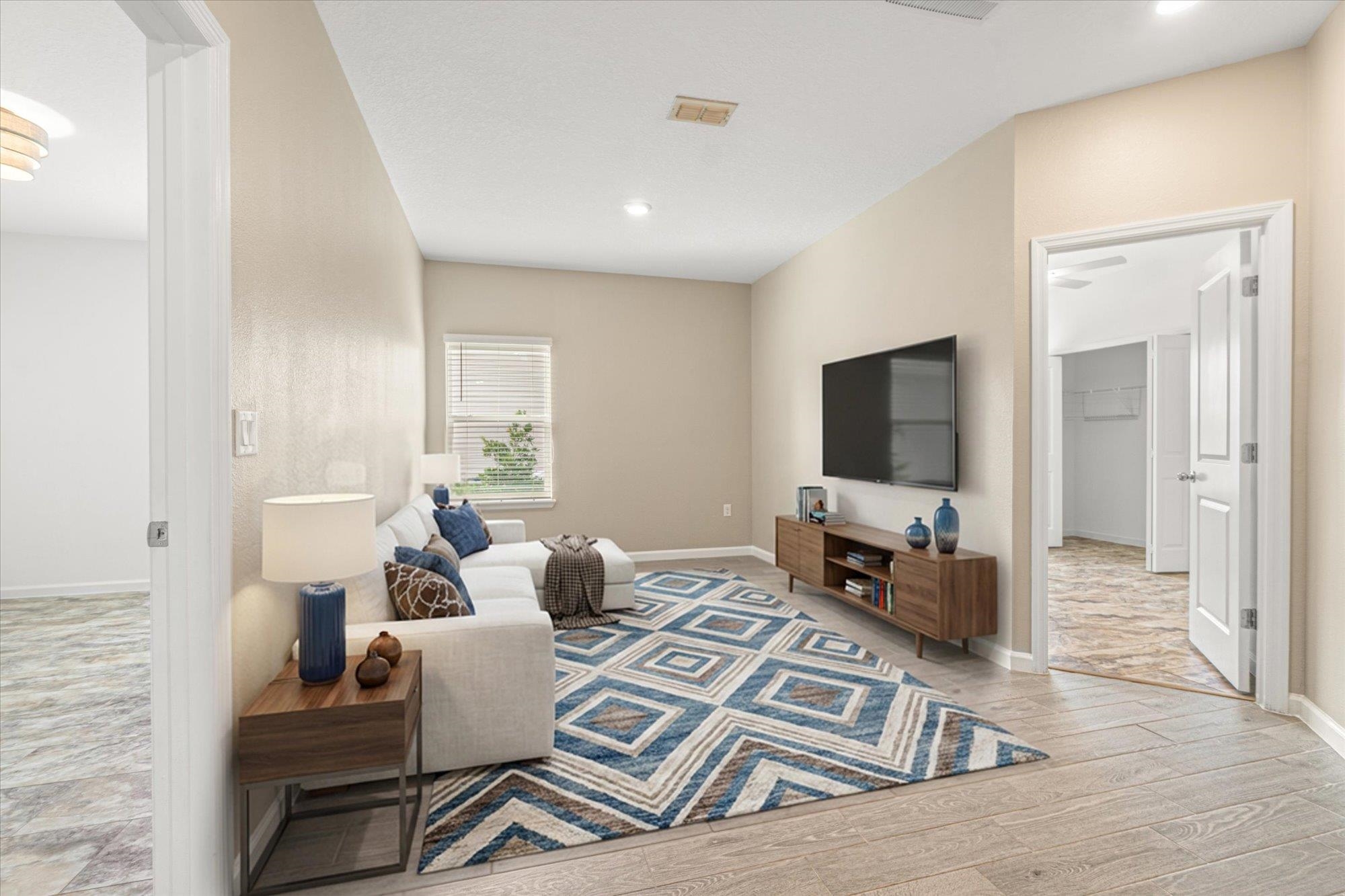 204 Field Flower Way St. Augustine, FL 32092 - Photo 26 of 60 a living room with furniture and a flat screen tv