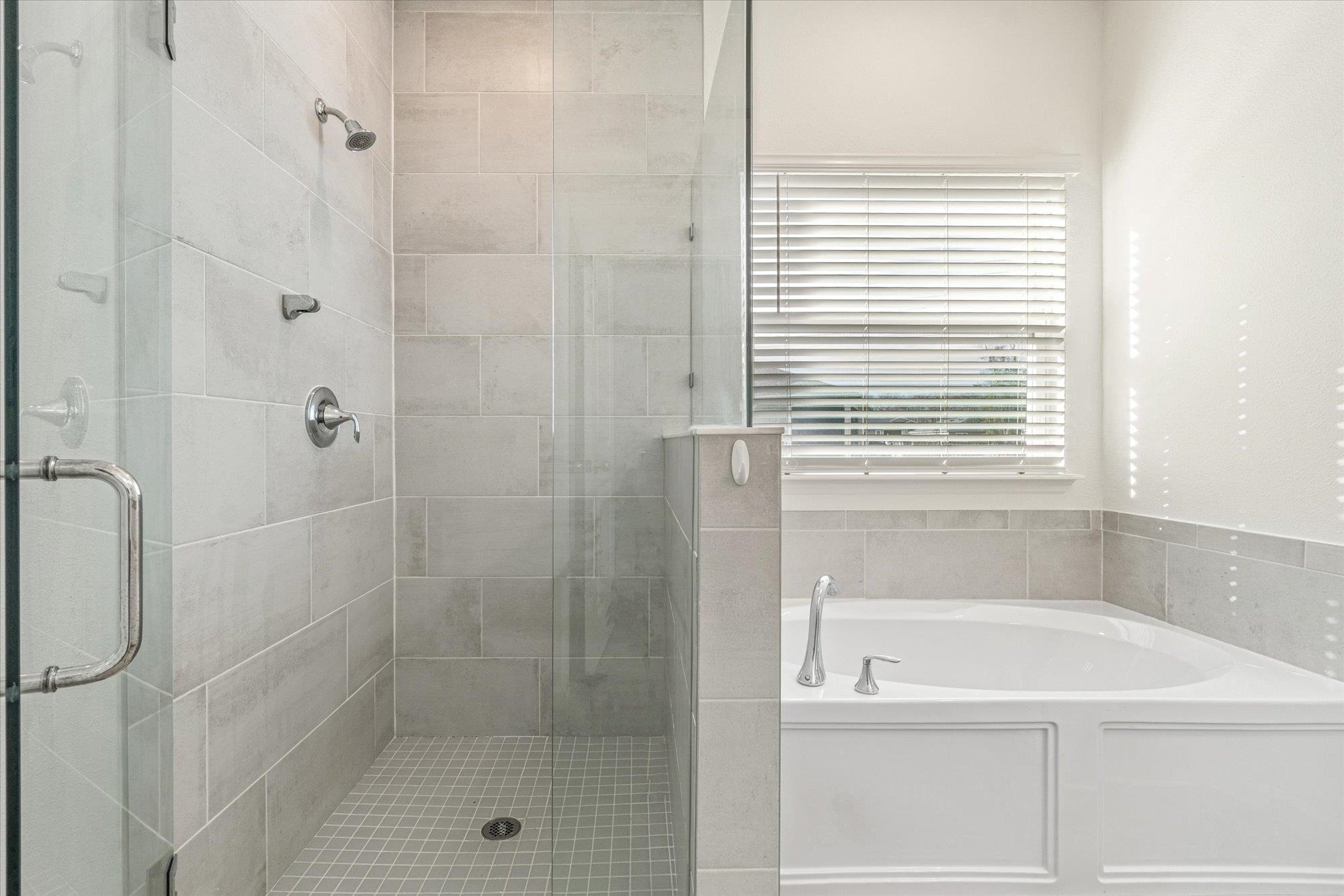 204 Field Flower Way St. Augustine, FL 32092 - Photo 41 of 60 a bathroom with a shower and a window