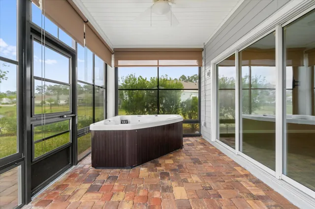 a view of a house with a yard and sitting area