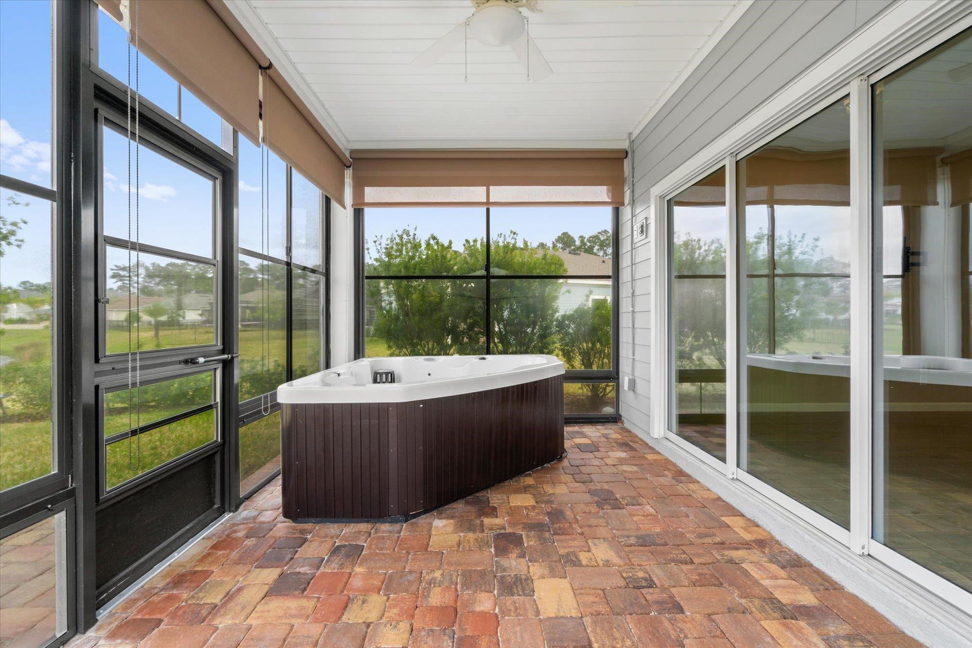 204 Field Flower Way St. Augustine, FL 32092 - Photo 45 of 60 Sunroom featuring a ceiling fan, a jacuzzi, and healthy amount of natural light
