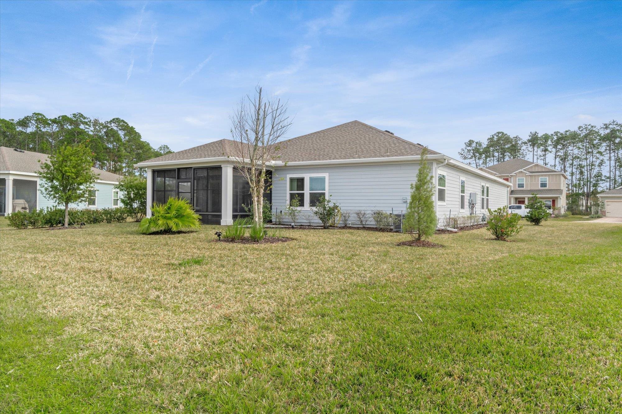 204 Field Flower Way St. Augustine, FL 32092 - Photo 48 of 60 a front view of a house with a garden