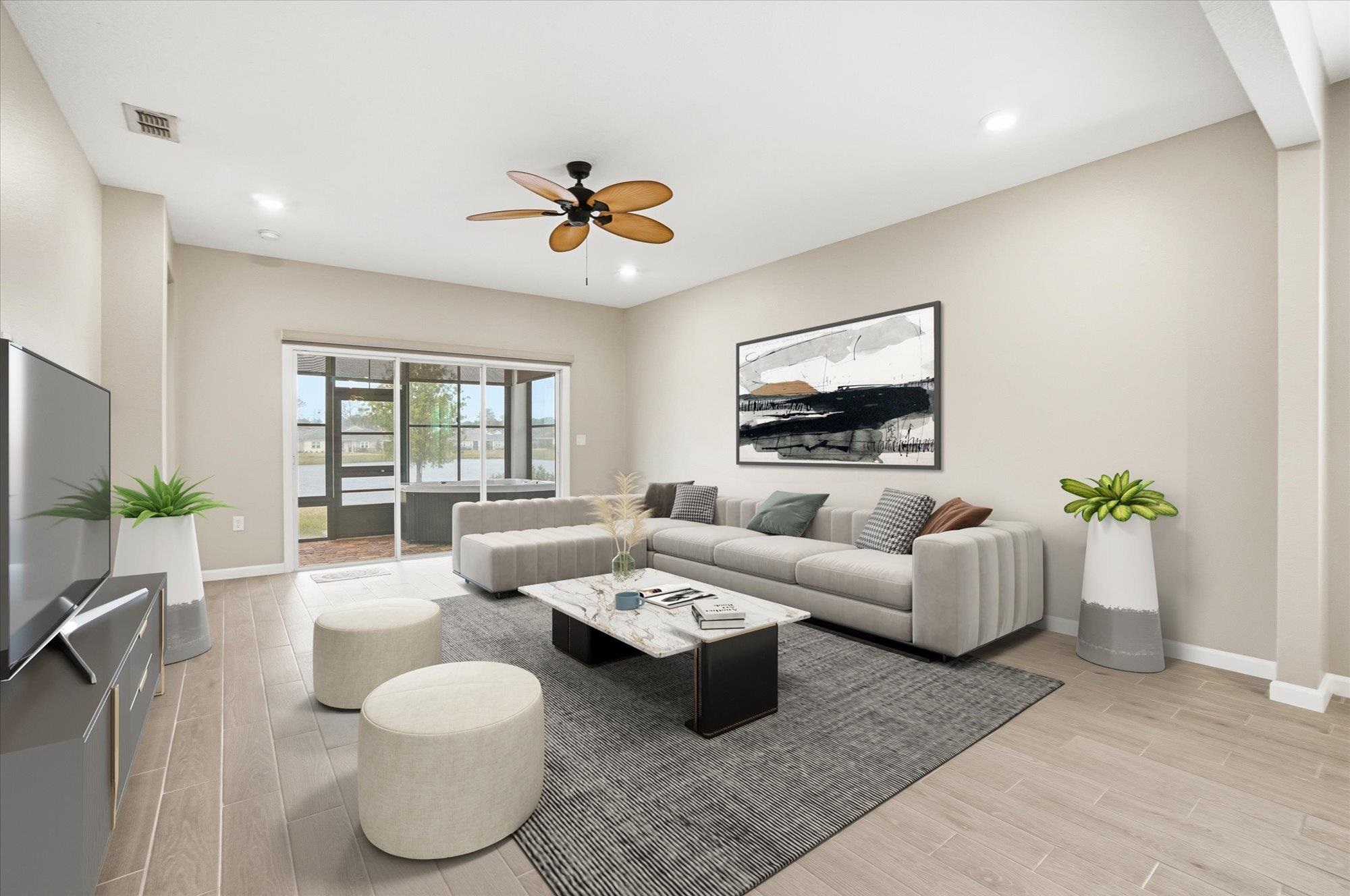 204 Field Flower Way St. Augustine, FL 32092 - Photo 5 of 60 a living room with furniture and a flat screen tv