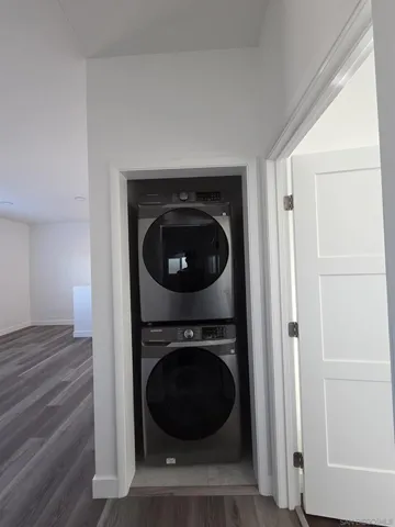a view of a hallway with washer and dryer