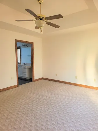 a view of an empty room and a window