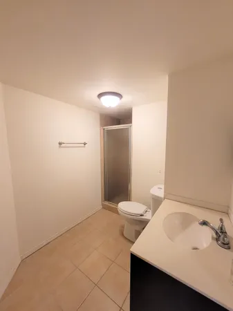 a view of an empty room with furniture
