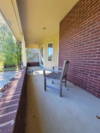 a view of a patio with a yard