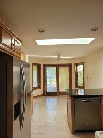 a view of a refrigerator and window
