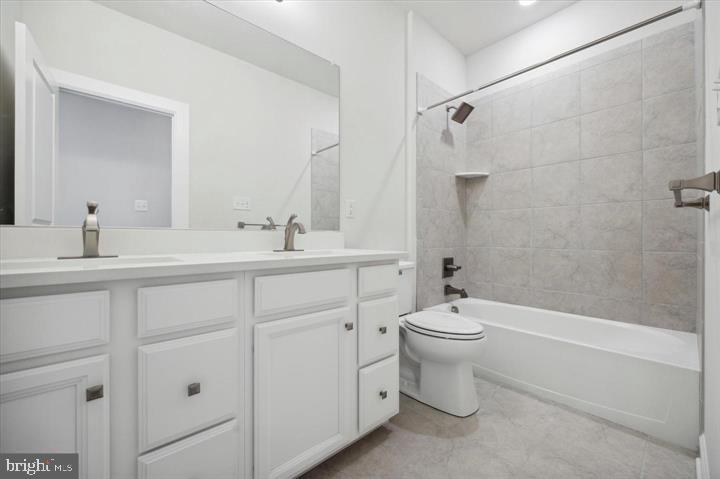 325 Piper Lane Exton, PA 19341 - Photo 14 of 24 a bathroom with a double vanity sink toilet and shower