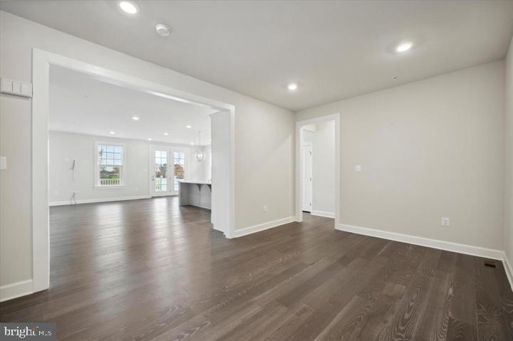 325 Piper Lane Exton, PA 19341 - Photo 7 of 24 an empty room with wooden floor and windows
