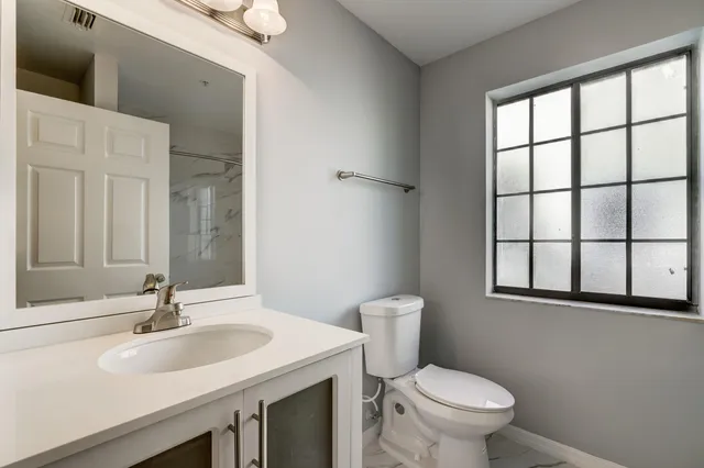 a bathroom with a sink and a toilet