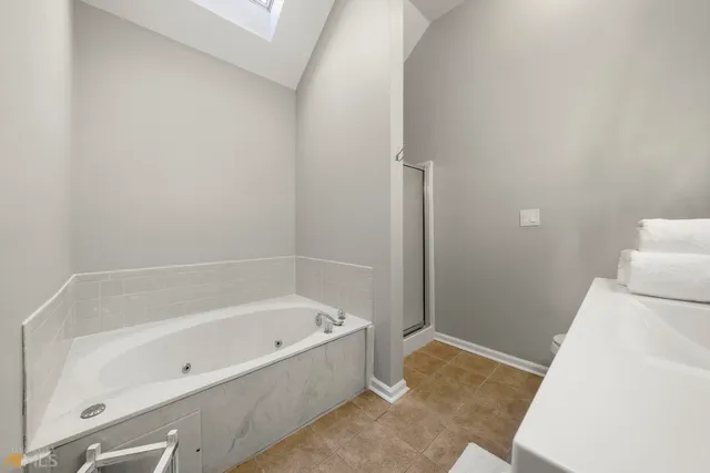 a white bath tub sitting in a bathroom