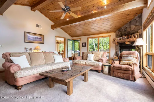 a kitchen with a refrigerator a sink and a microwave