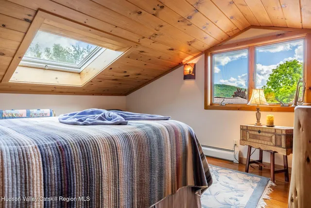 a bathroom with a double vanity sink toilet and a mirror