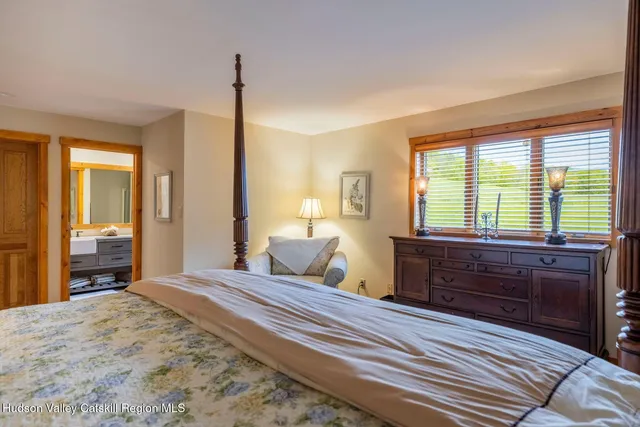 a front view of a house with a yard table and chairs