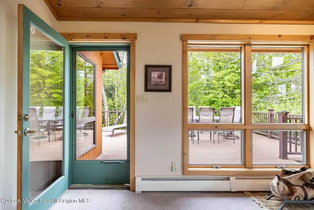 an aerial view of a houses with a yard