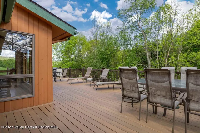 a picture of a room with a white wall and a picture