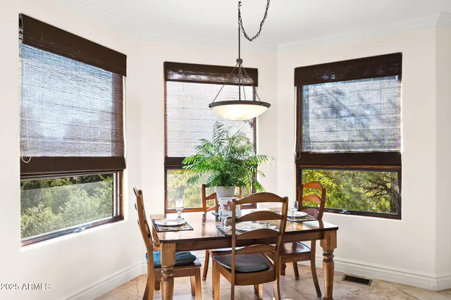 a view of a dining room with furniture window and outside view