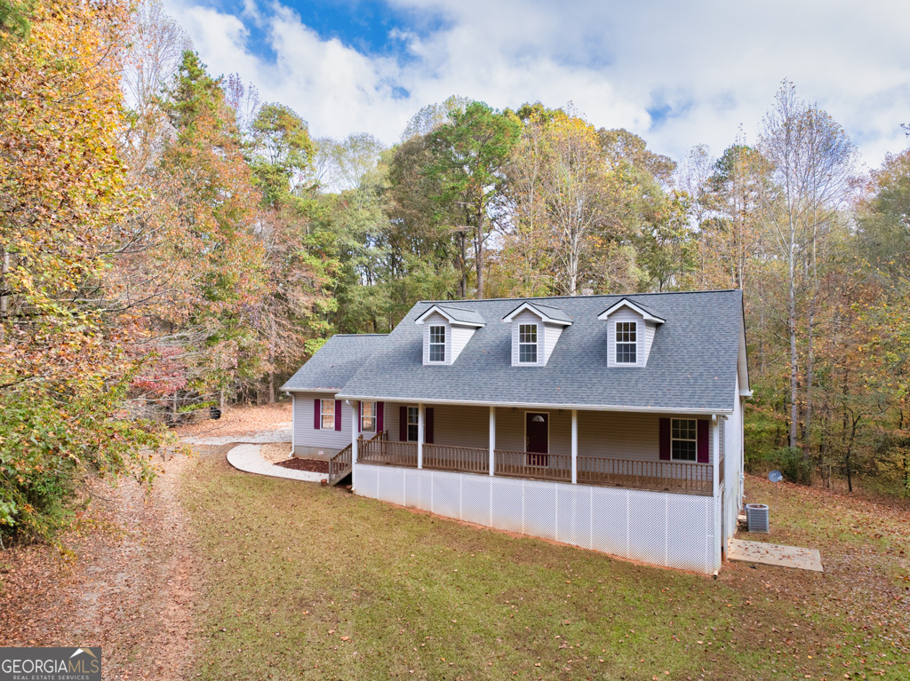 902 Grove Level Road Maysville, GA 30558 - Photo 1 of 1 a front view of a house with a yard and large tree