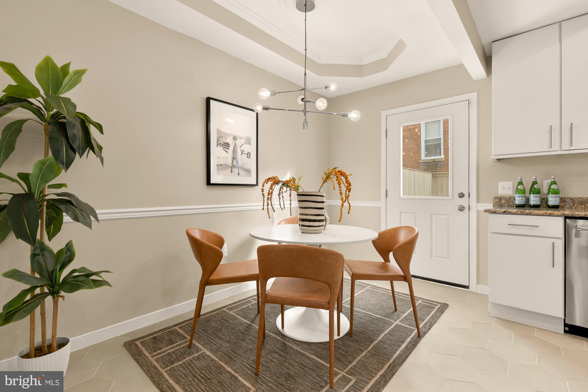 1923 1st Street Northeast Washington, DC 20002 - Photo 13 of 42 a dining room with furniture and a chandelier