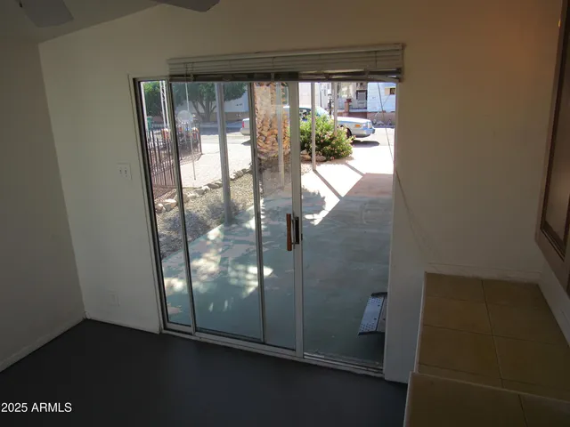 a view of a glass door and chair