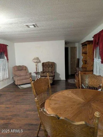 a bedroom with furniture and a chair