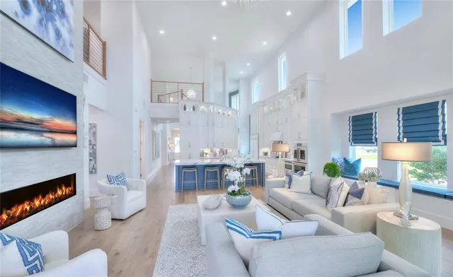 a living room with furniture a dining table and a fireplace