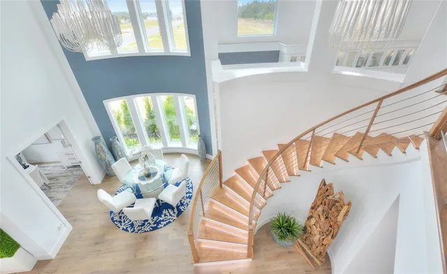 a spacious bedroom with a bed and a large window