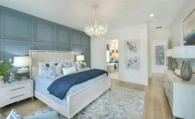a en suite bathroom with a double vanity sink a large mirror and a shower