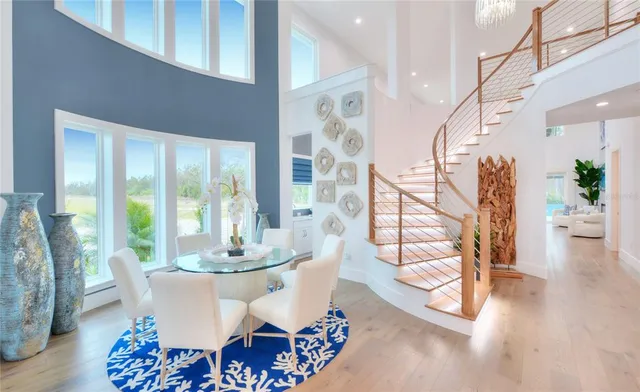 a view of a dining room with furniture window and wooden floor