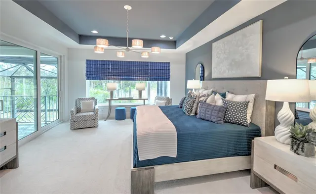 a bedroom with bed and a chandelier