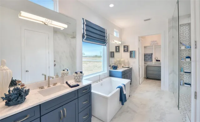 a spacious bathroom with a double vanity sink and a mirror