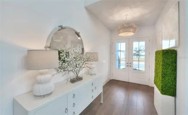 a view of entryway with furniture and wooden floor