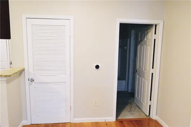 a bathroom with a glass shower door